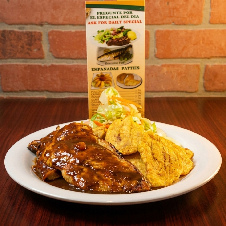 Plate of sauced meat, fried plantains, and salad on a table with a daily special menu.